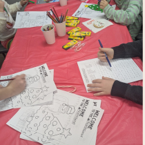 Here is a photo of children coloring at the Evart Santa Meet and Greet event. 