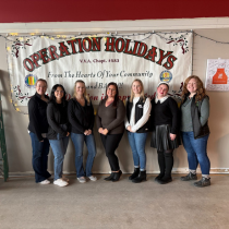 Here is a photo of a group of Blue Ox Young Professionals at the Alpena Operation Holidays volunteering to wrap gifts.