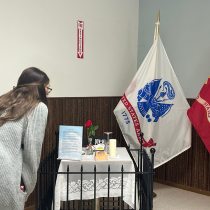 Here is a photo of Northland employee, Kay, reading the Veterans memorial at the Iosco County Veterans Luncheon.