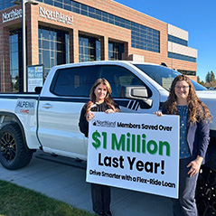 Image of Jenn and Jessica holding sign for Flex Ride Savings